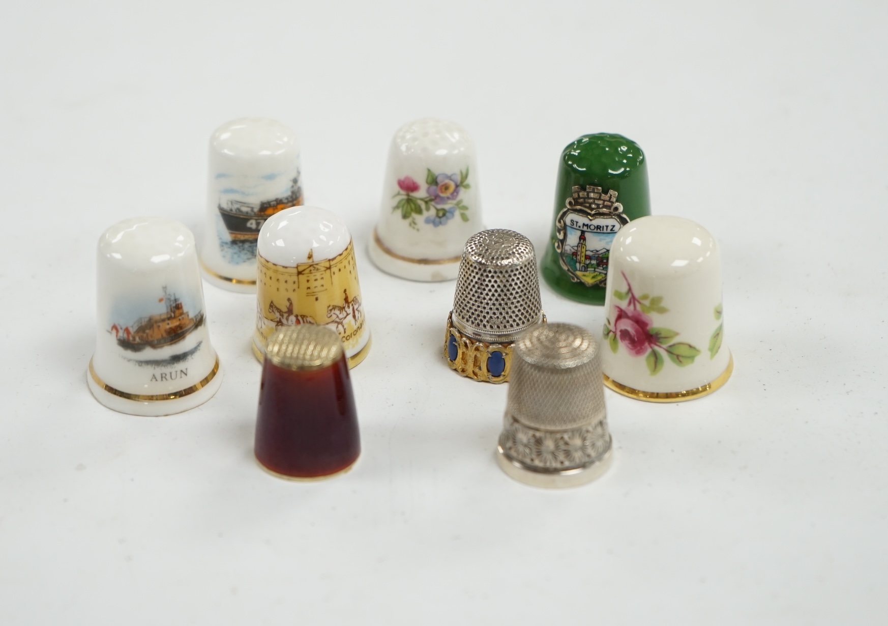 A large collection of silver, nickel, brass and ceramic thimbles, and two thimble display perspex domes. Condition - fair